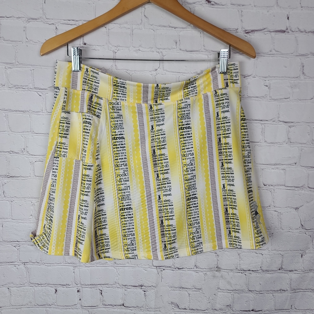 Runningskirts     Yellow, white,gray, and black. Sz XL.